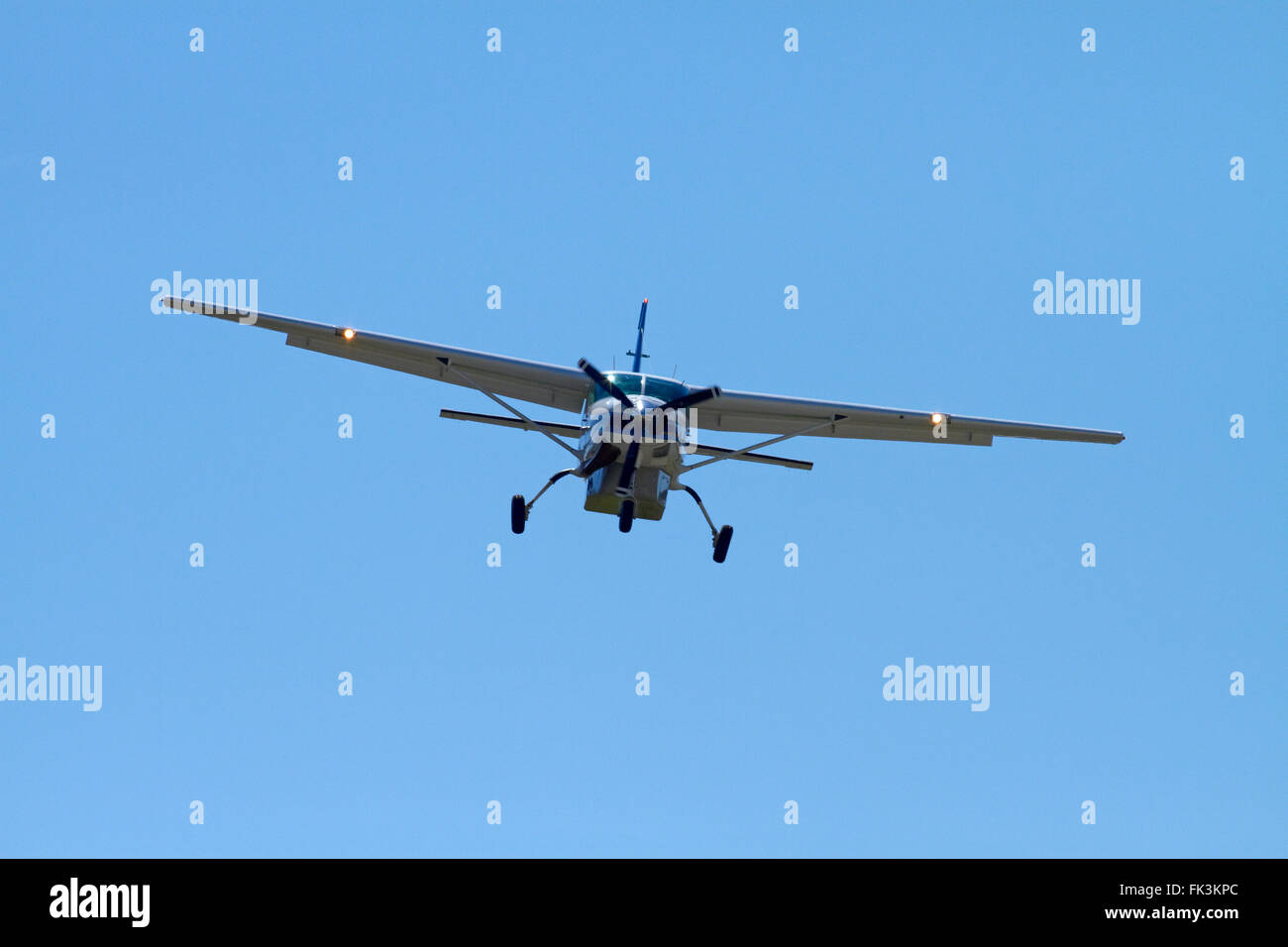 Air Milford tourist plane (Cessna 208) landing at Queenstown Airport ...