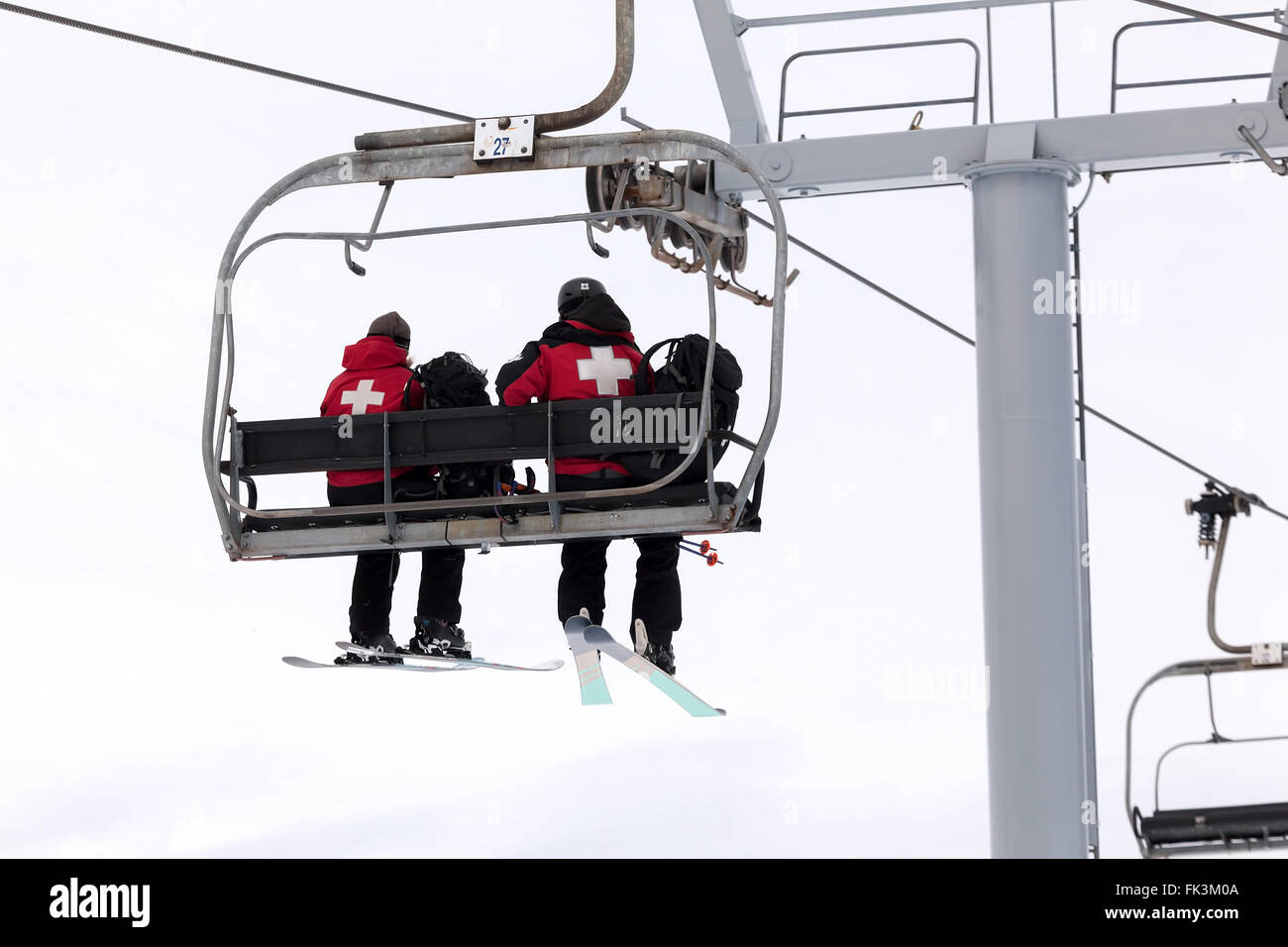 US Forest Service Rescue Crew Riding Ski Lift up to the Slopes of Mount Hood in Oregon Stock Photo