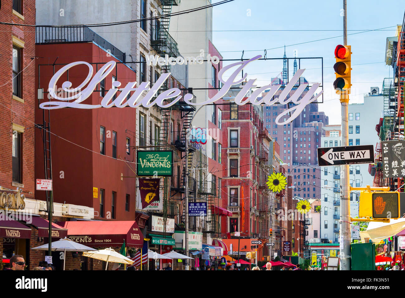 NEW YORK CITY, USA – AUGUST 21, 2015: The busy streets of Little Italy are crowded with tourists during an Italian summer street Stock Photo