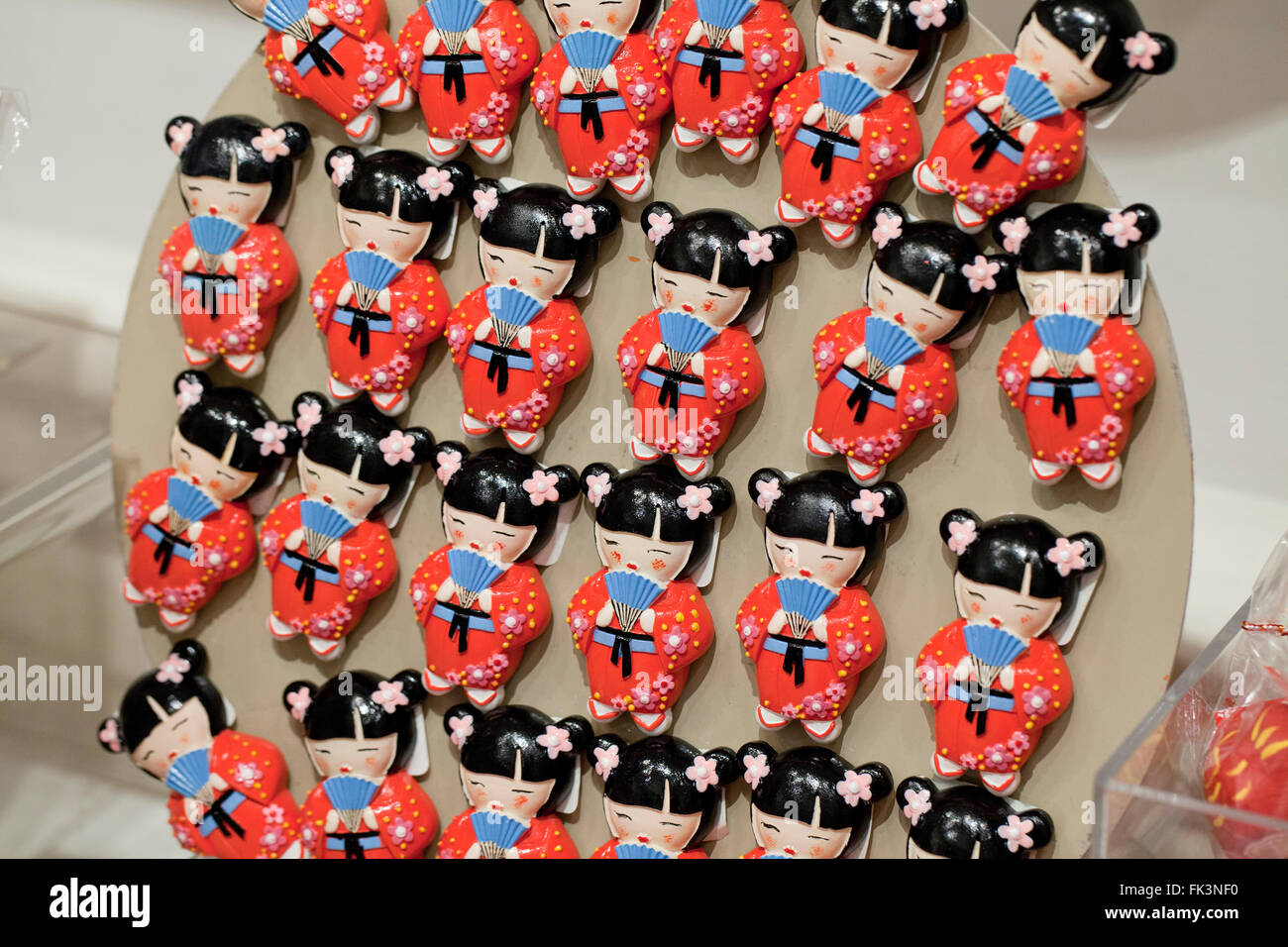 Japanese Cherry Blossom celebration doll refrigerator magnets on display at gift store - USA Stock Photo