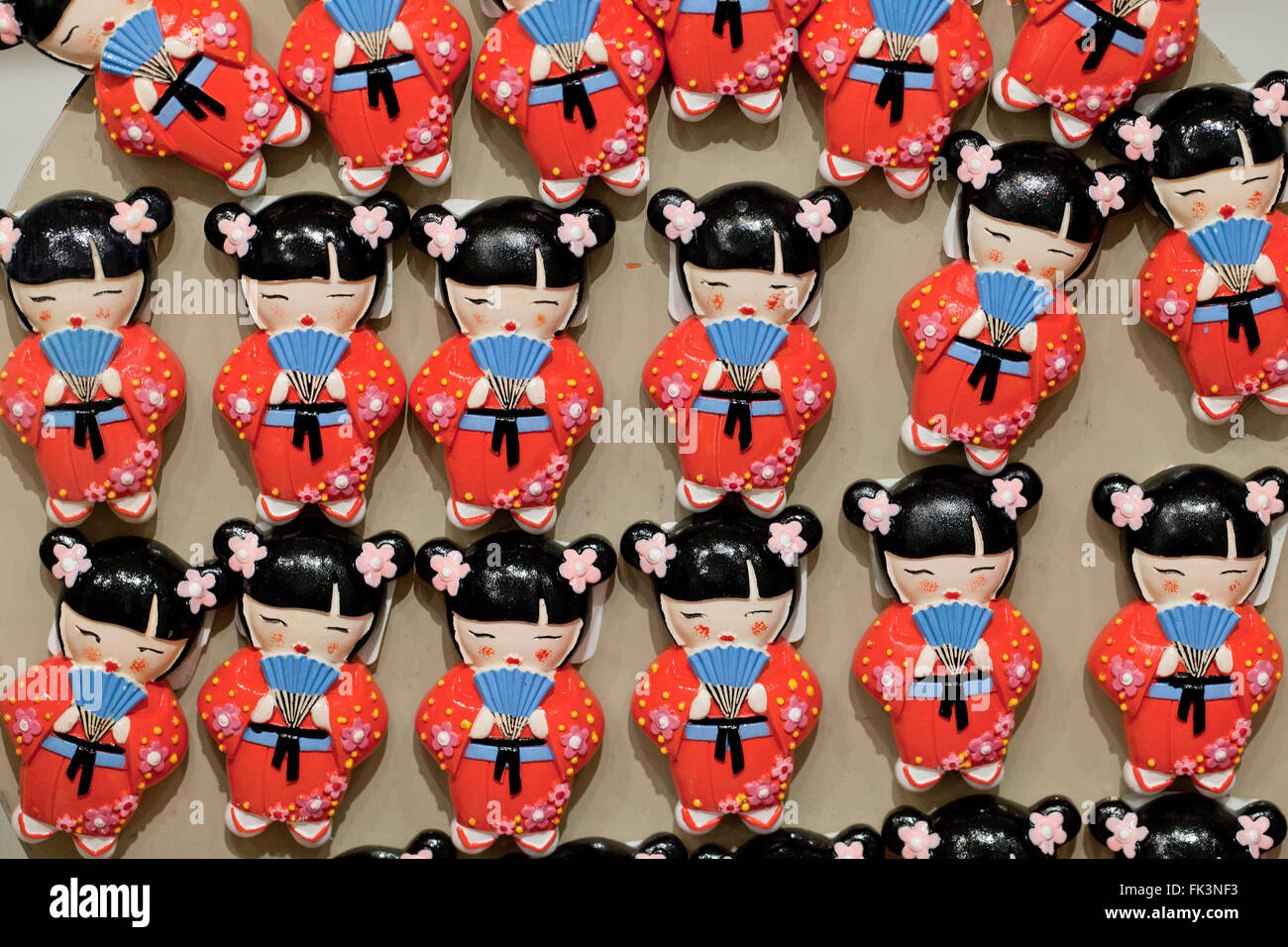 Japanese Cherry Blossom celebration doll refrigerator magnets on display at gift store - USA Stock Photo