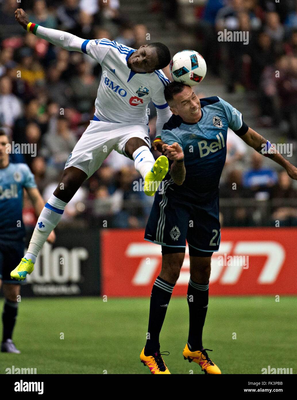 Vancouver, Canada. 6th Mar, 2016. Montreal Impact player Ambroise Oyongo (L) competes for a header with Whitecap player Blas Perez during an MLS game in Vancouver, Canada, March 6, 2016. Montreal Impact won 3-2. © Andrew Soong/Xinhua/Alamy Live News Stock Photo