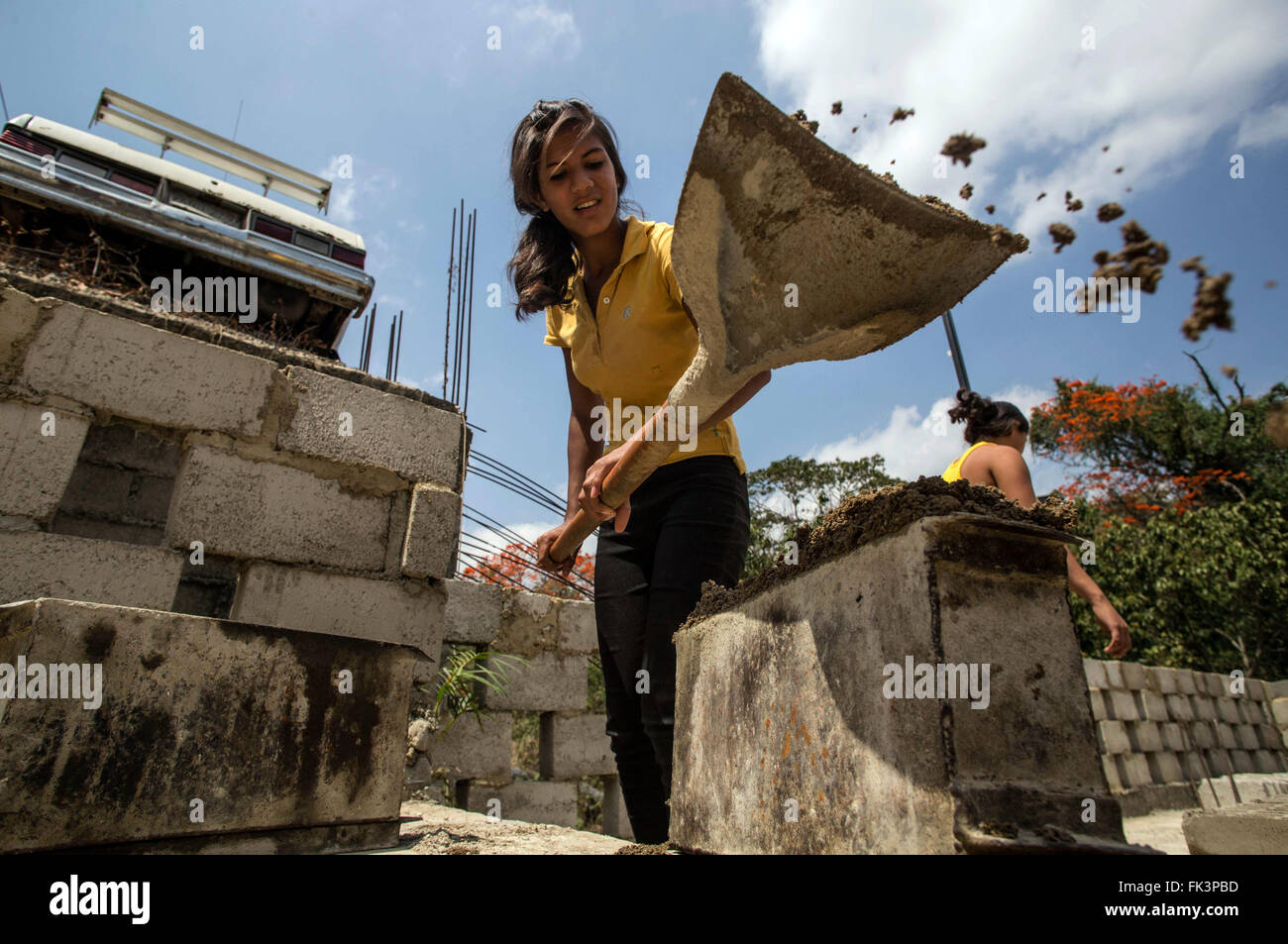 (160307) -- MIRANDA, March 7, 2016 (Xinhua) -- Image taken on March 4, 2016 shows Franyelis Sauce of 16 years old working in the cooperative 'Women on the Cement' in the neighborhood of Petare, capital of the municipality of Sucre, Miranda state, Venezuela. The cooperative 'Women on the Cement' was initiated in 2010 by Coromoto Rengifo, a retired educator, and his two daughters, Kheinin and Kheilin. This group of eight women produces up to 150 blocks of cement daily. The International Women's Day is celebrated annually on March 8. The theme for 2016 is 'Planet 50-50 by 2030: Step It Up for Gen Stock Photo