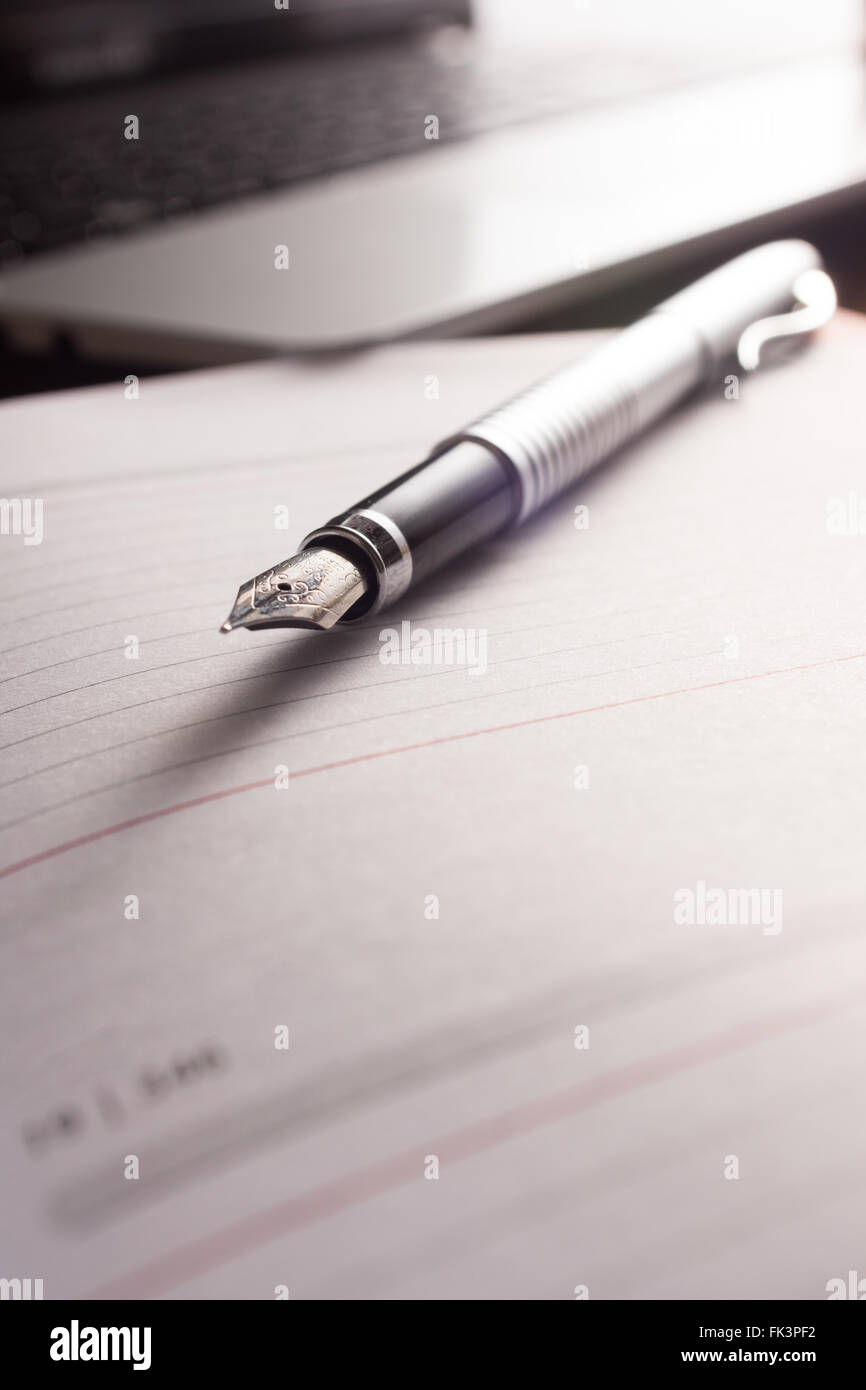 High resolution image, showing a desk working space, with laptop, agenda, pen, phone. Stock Photo