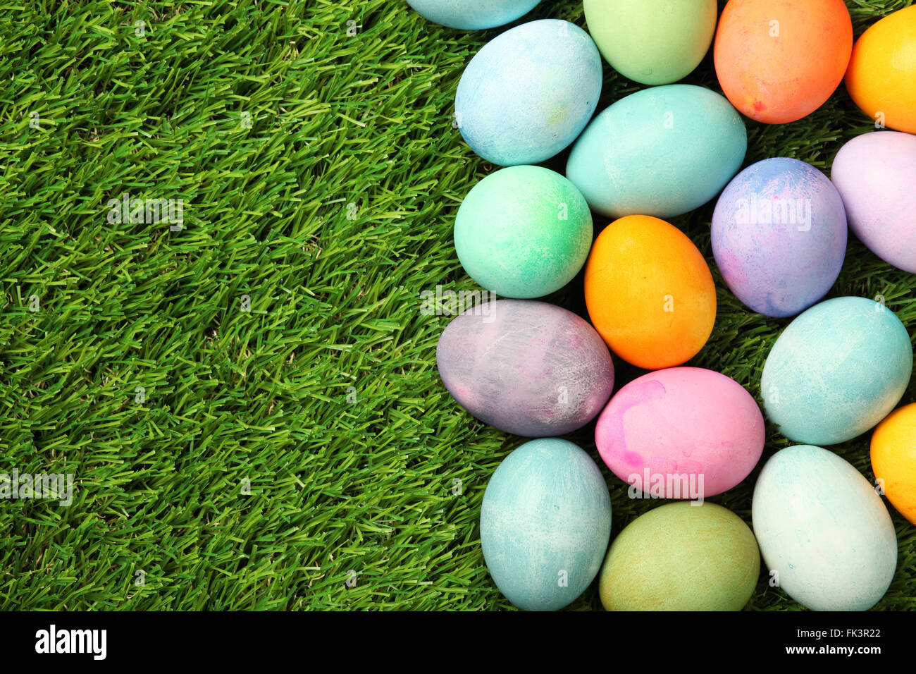 Colorful Easter eggs on grass background Stock Photo