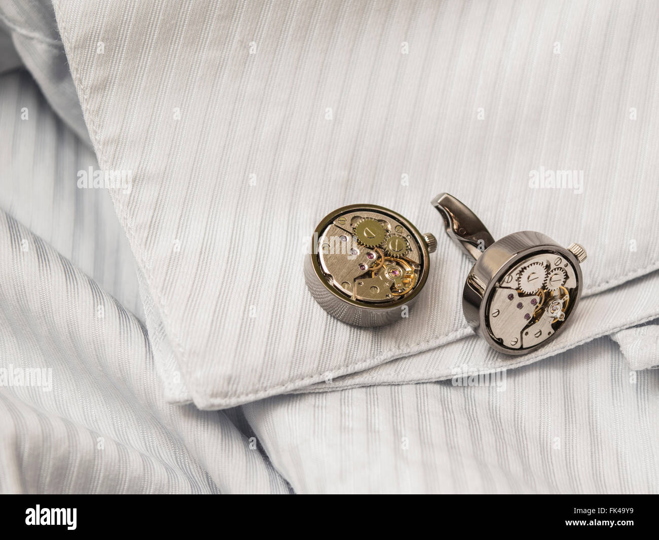 Cufflinks on a shirt sleeve Stock Photo