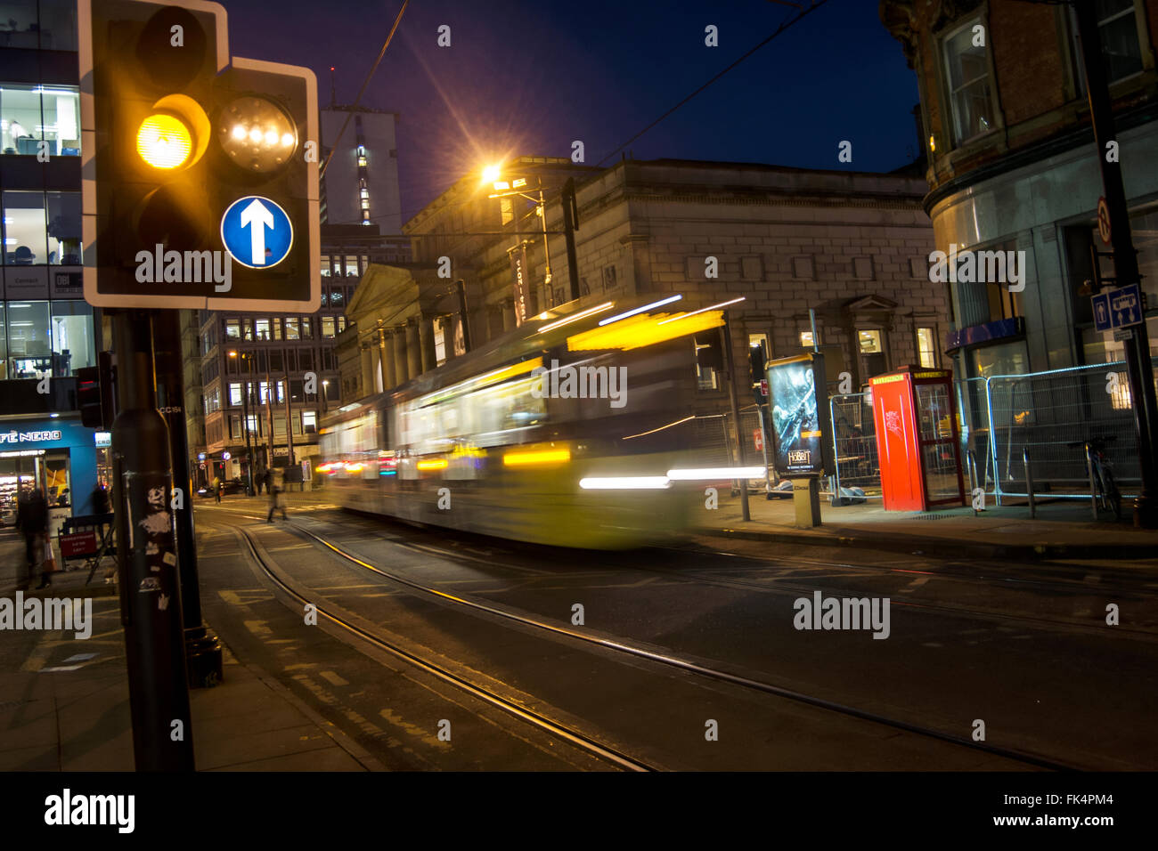 Metrolink tram entering St. Peters Square in Manchester in the evening. Stock Photo