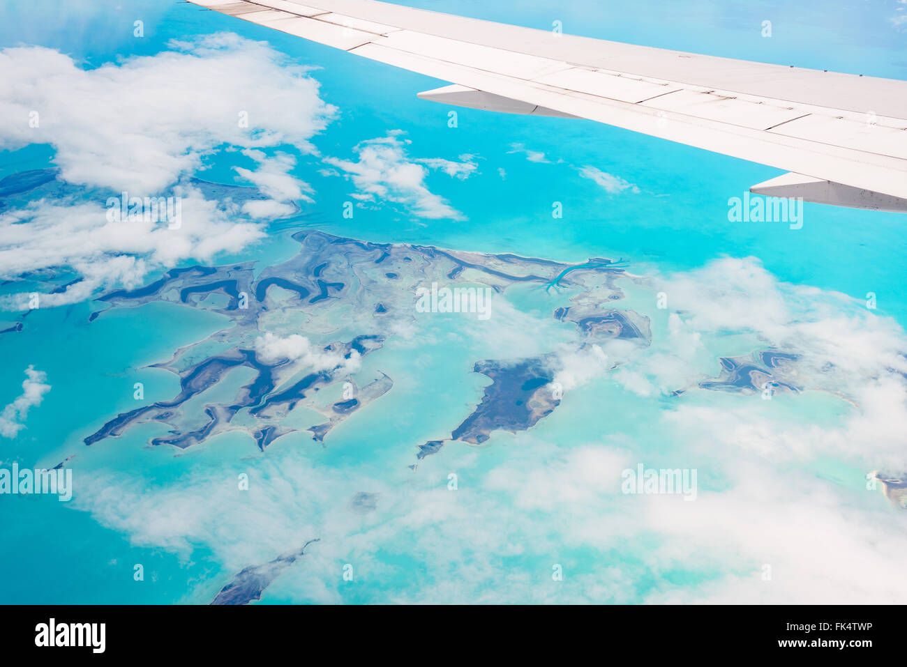 Aerial view of the Bahamas, stunning islands, sand bars and coral reefs with turquoise sea, shot from aeroplane. Stock Photo