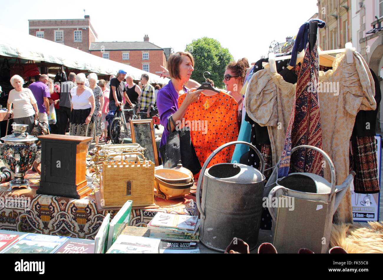 Visitors rummage for bargains on the flea market in Market Place in Chesterfield town centre, Derbyshire England UK Stock Photo