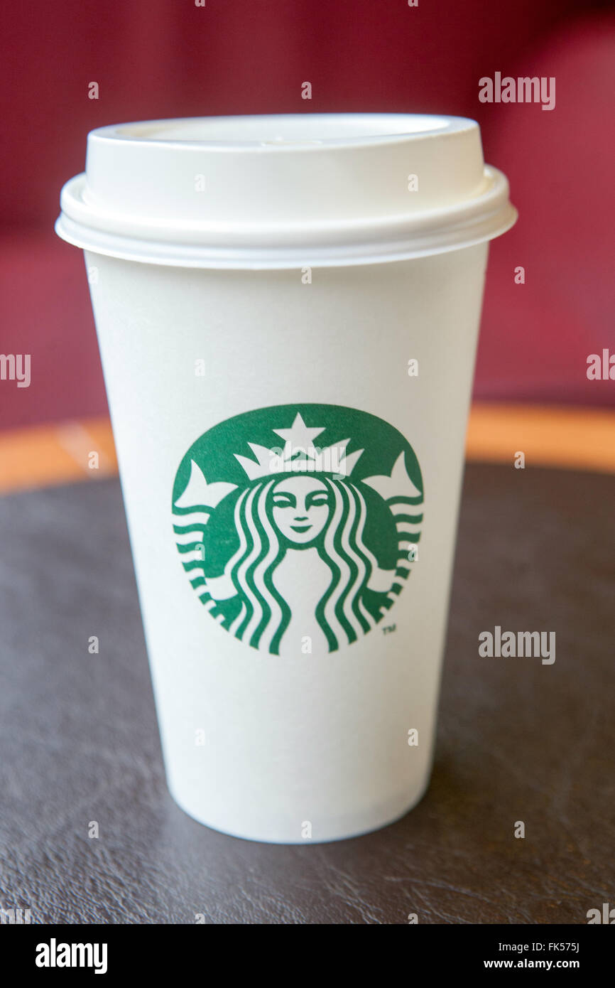 Starbucks coffee cup on a table Stock Photo