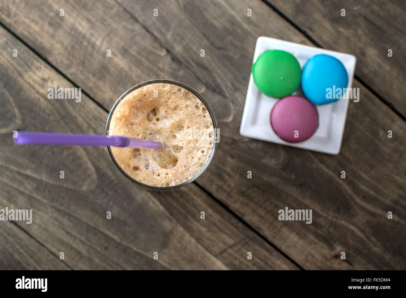 Macaron cookies and coffee on table, from above Stock Photo