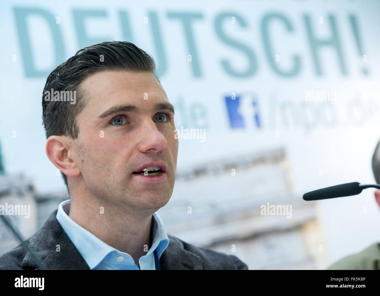 Berlin, Germany. 07th Mar, 2016. Frank Franz, federal chairman of the right-wing extremist National Democratc Party (NPD), speaks at a press conference on the proceedings in the NPD ban and the coming parliamentary elections in NPD party headquarters in Berlin, Germany, 07 March 2016. Photo: BERND VON JUTRCZENKA/dpa/Alamy Live News Stock Photo