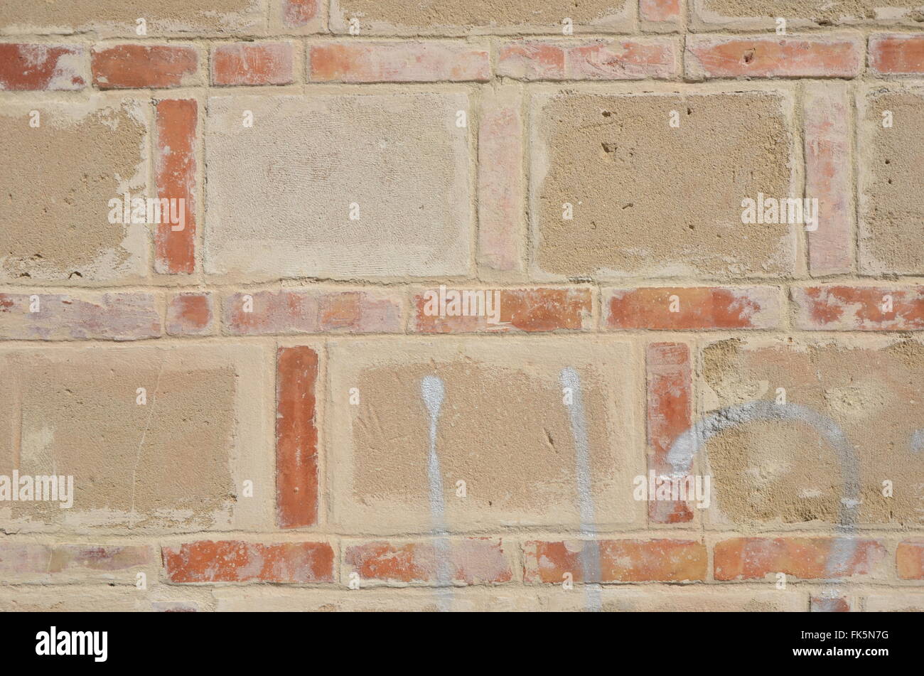 Brick wall with large and small brick Stock Photo - Alamy