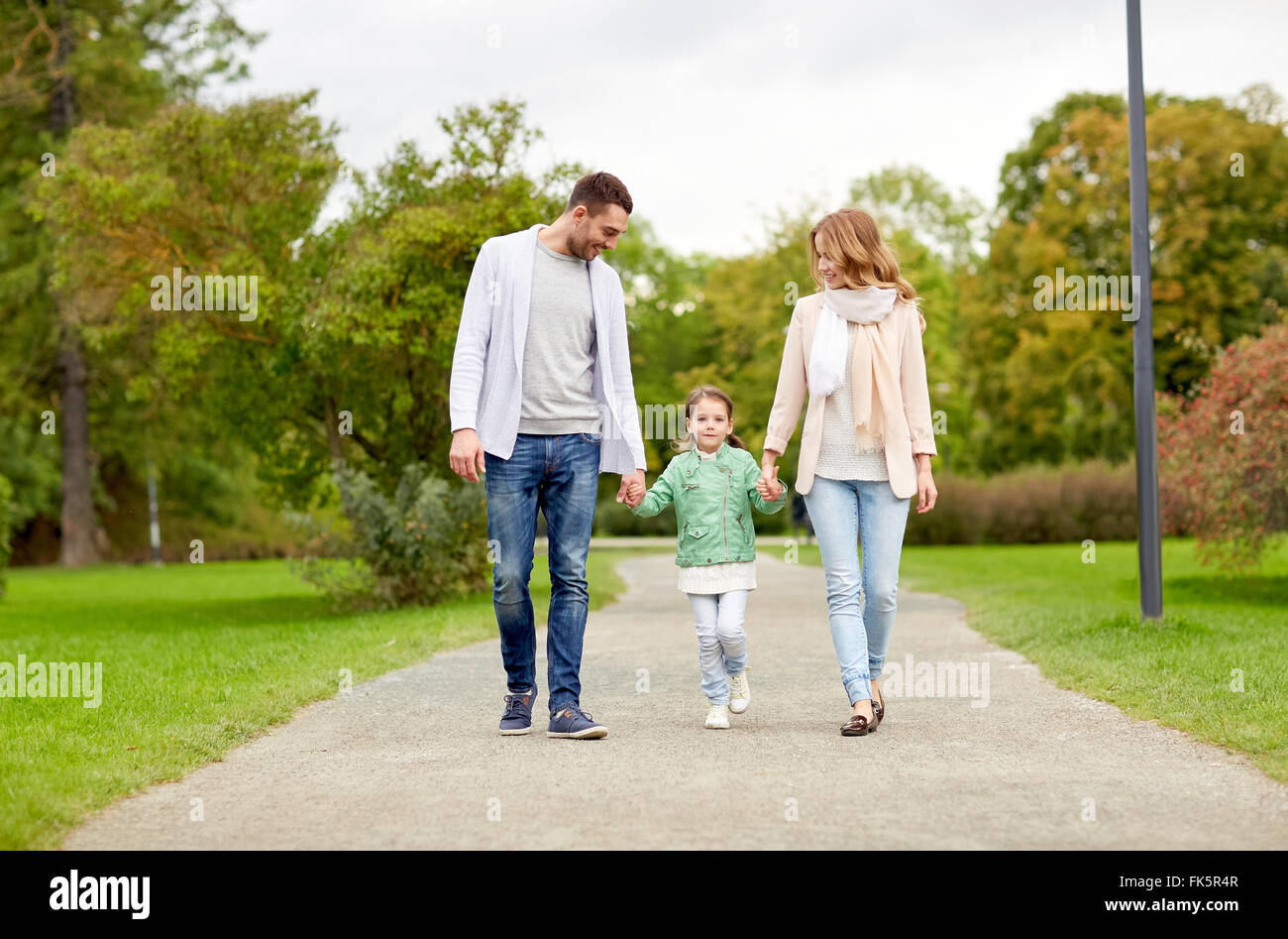 happy family walking in summer park Stock Photo - Alamy