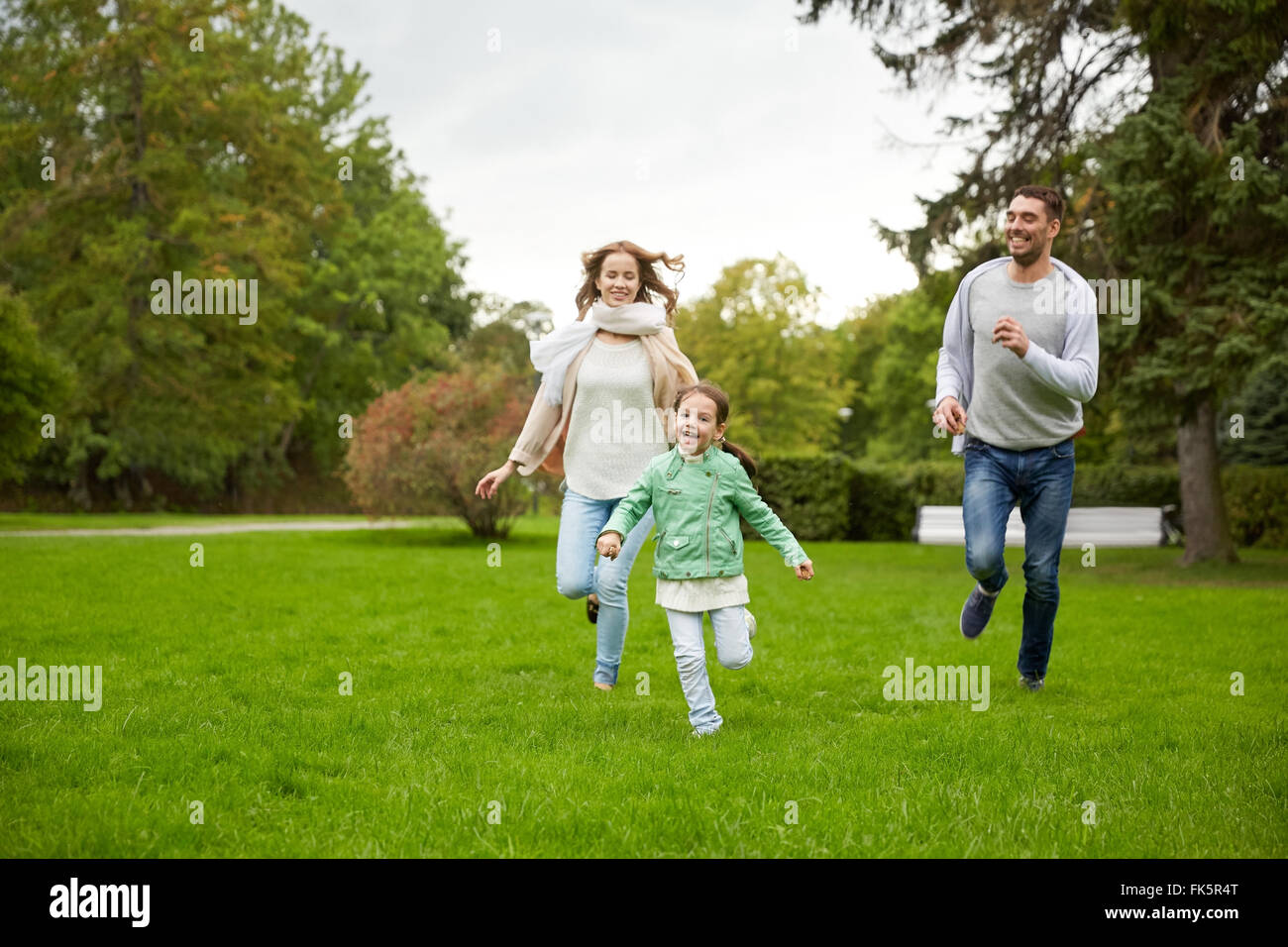 happy family walking in summer park Stock Photo - Alamy