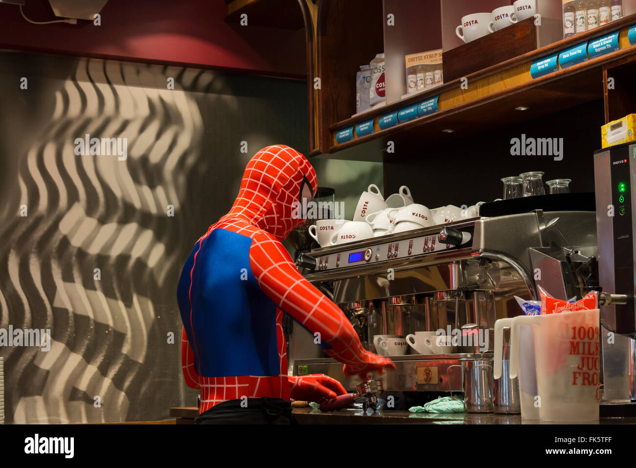 Person dressed as Marvel Spiderman making coffee in shop Derbyshire England Stock Photo - Alamy