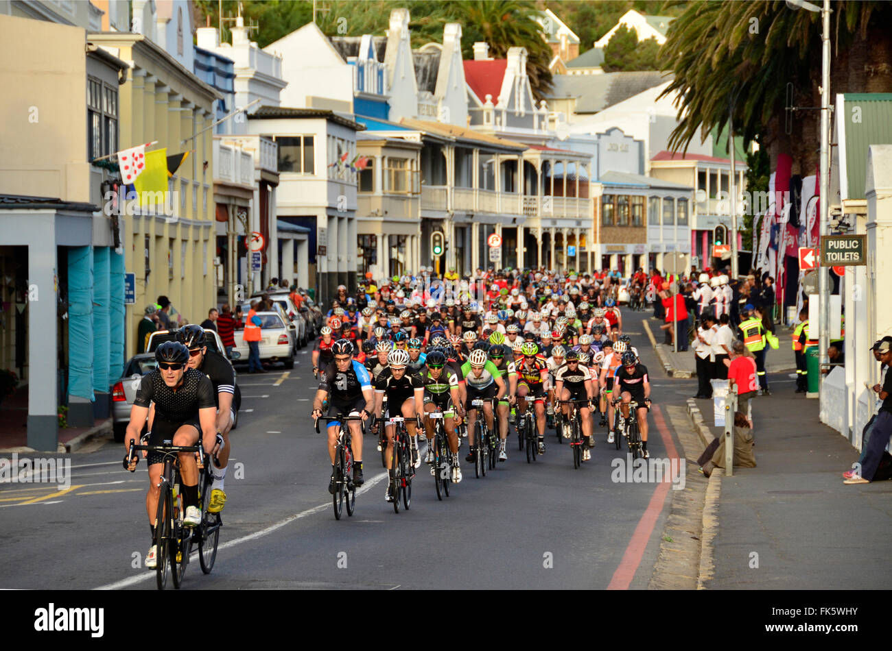 Leading riders in the Cape Town Cycle Tour come through historic Simon's Town on Sunday morning 6/3/2016. This event is the world's largest timed cycle race with 35000 entries. Stock Photo