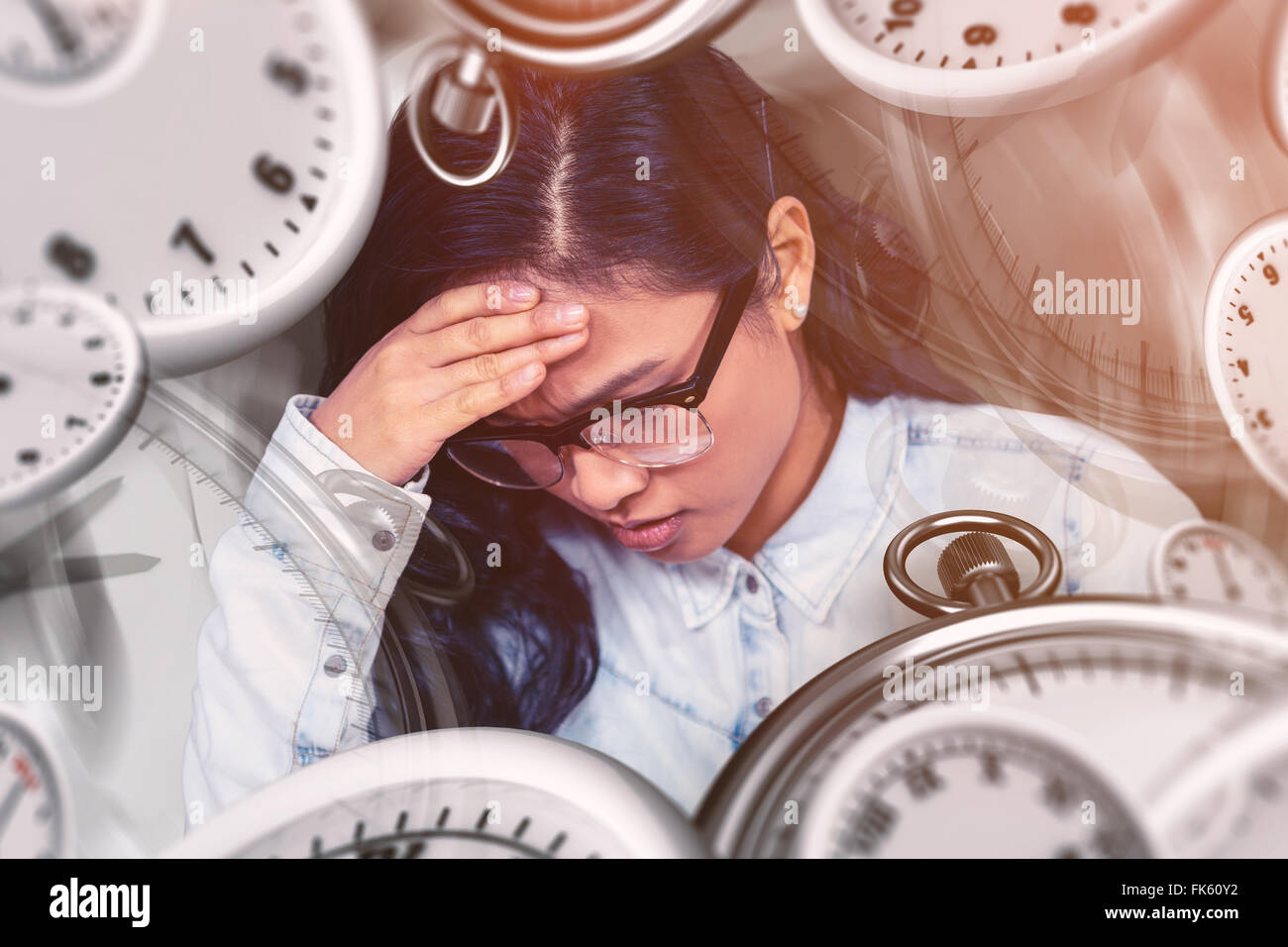 Composite image of troubled asian woman with hand on face Stock Photo