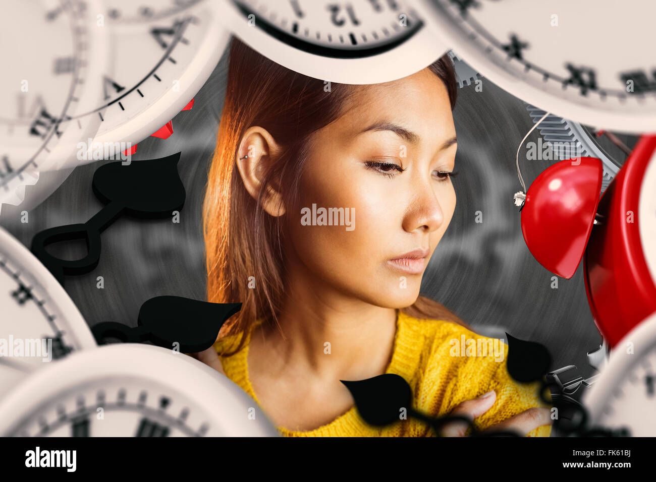 Composite image of serious asian woman looking down Stock Photo