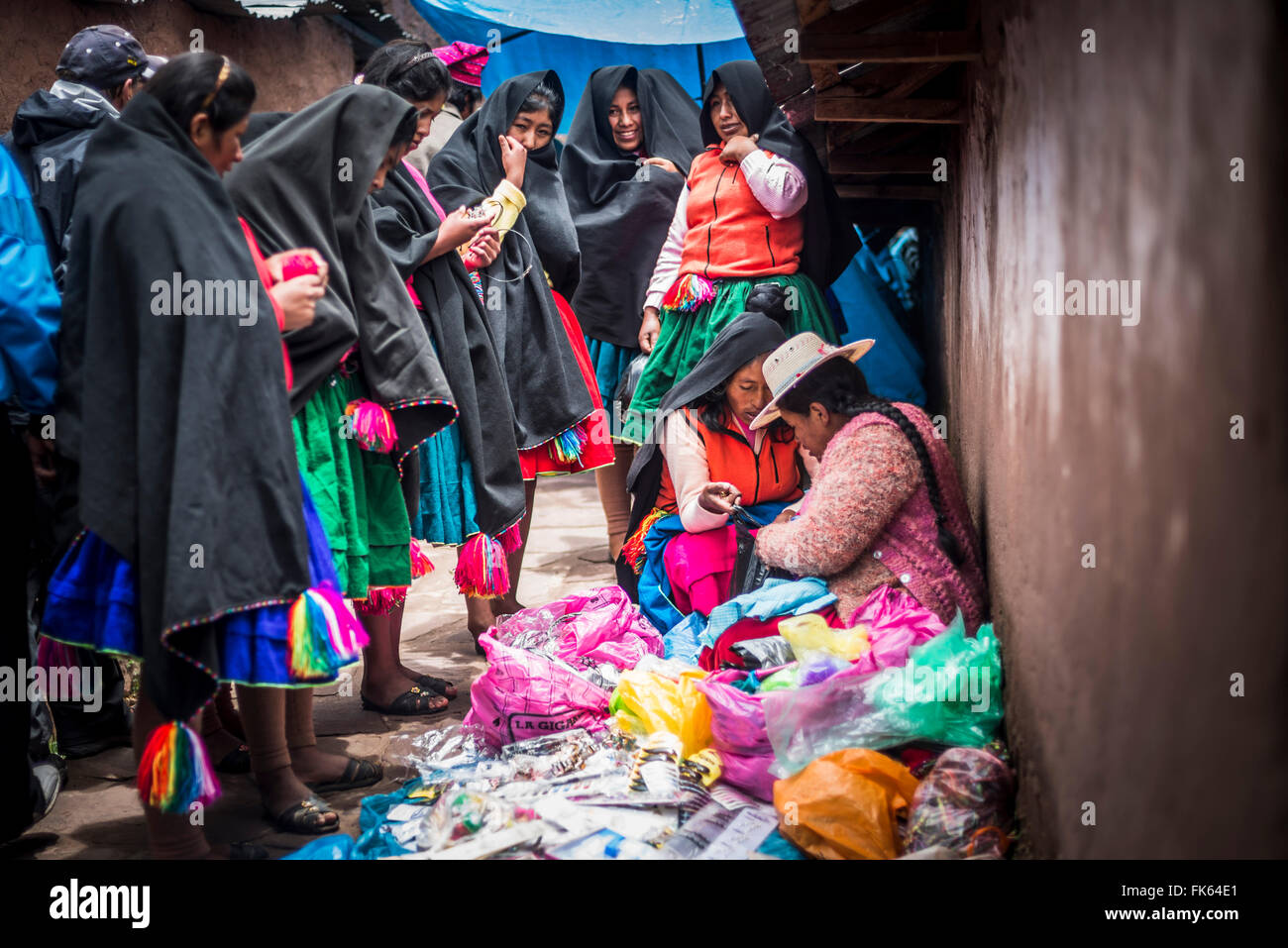 Traditional Peruvian Quechua women at Taquile Market on Taquile Island, Lake Titicaca, Peru, South America Stock Photo