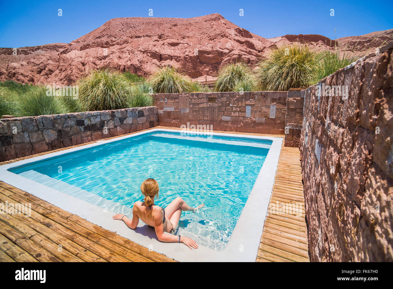 Woman at a swimming pool, Atacama Desert, Chile, South America Stock Photo