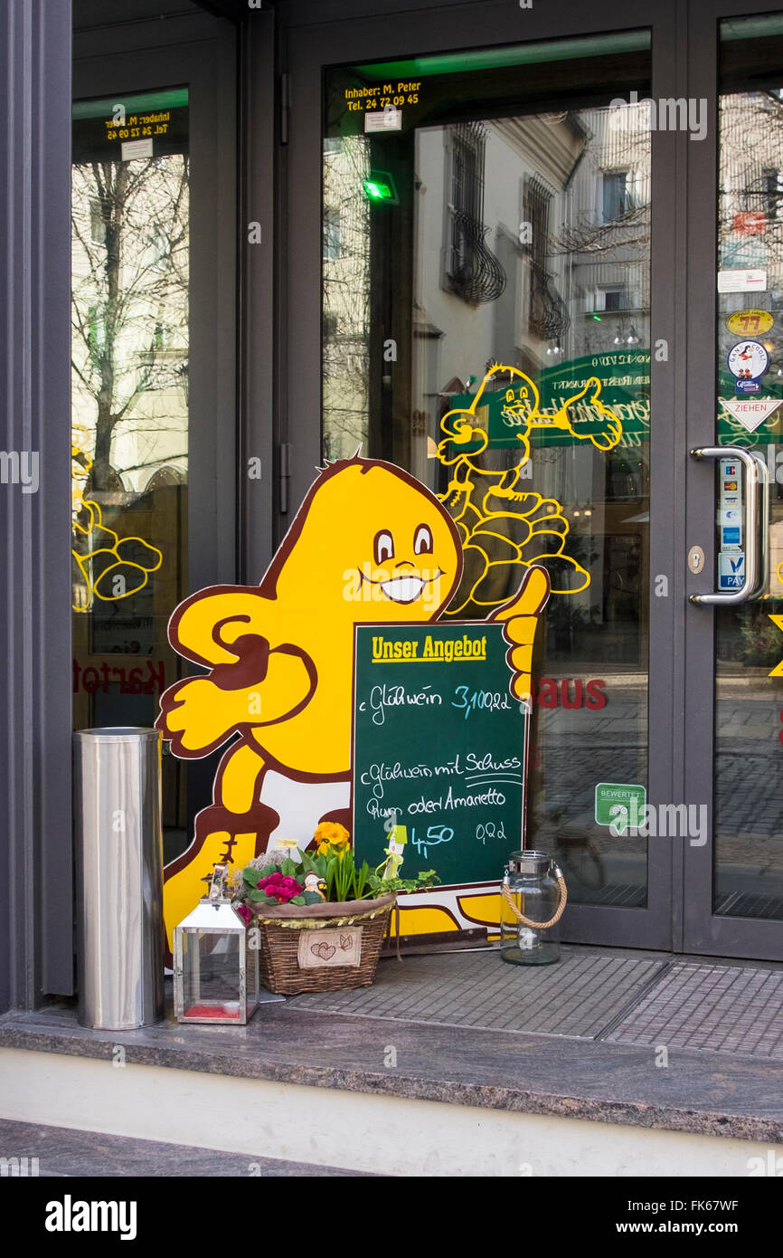 Berlin Old Town, Nikolaiviertel Altstadt. Restaurant sign. Outlet selling jacket potatoes, spuds, potato meals Stock Photo