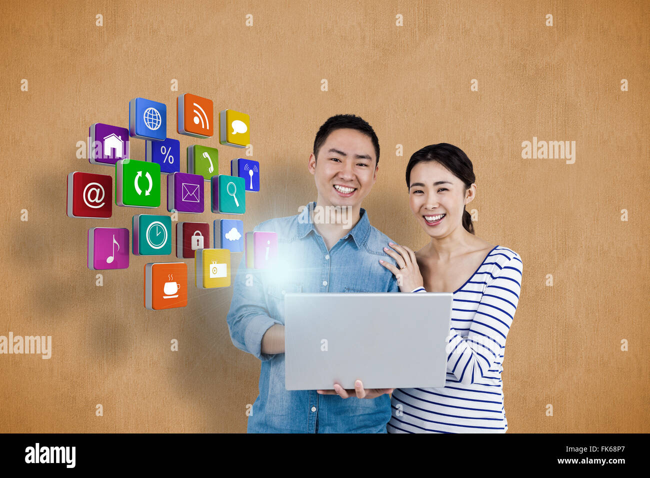 Composite image of portrait of couple using laptop Stock Photo - Alamy