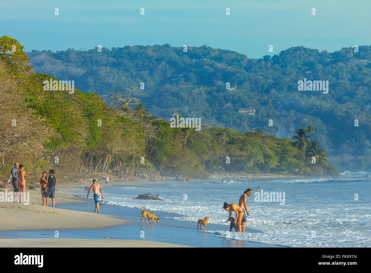 Beach walkers at this hip surf resort near Mal Pais, far south end of the Nicoya Peninsula, Santa Teresa, Puntarenas, Costa Rica Stock Photo