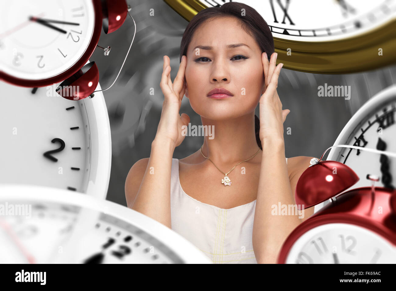 Composite image of concerned woman posing and looking at camera Stock Photo