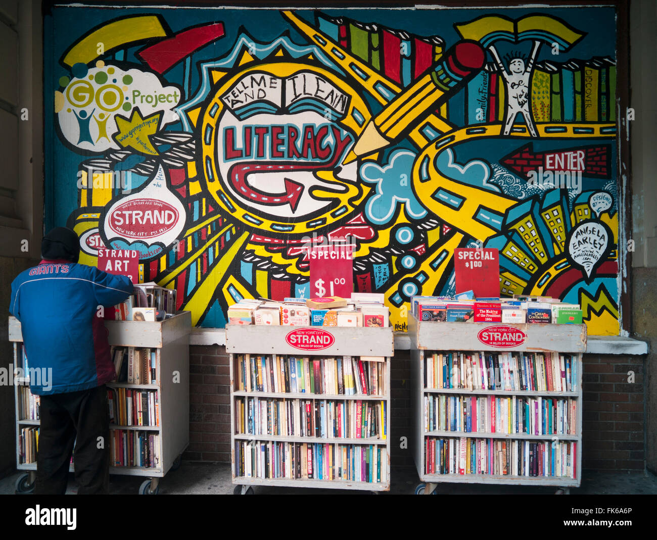 Man looking through the cheap books outside a New York bookstore, New