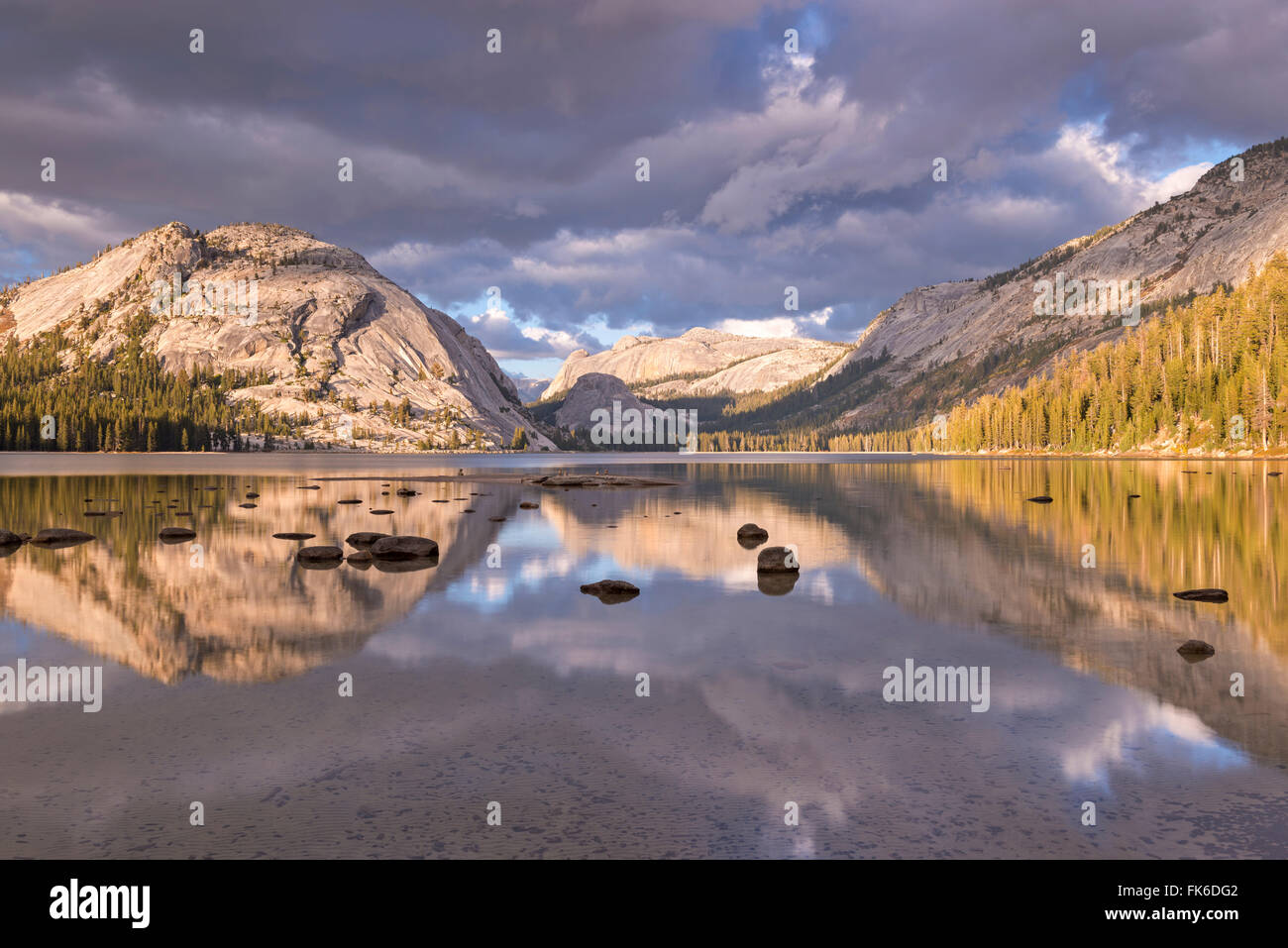 Granite mountains reflected in Tenaya Lake, Yosemite National Park, UNESCO, California, United States of America Stock Photo