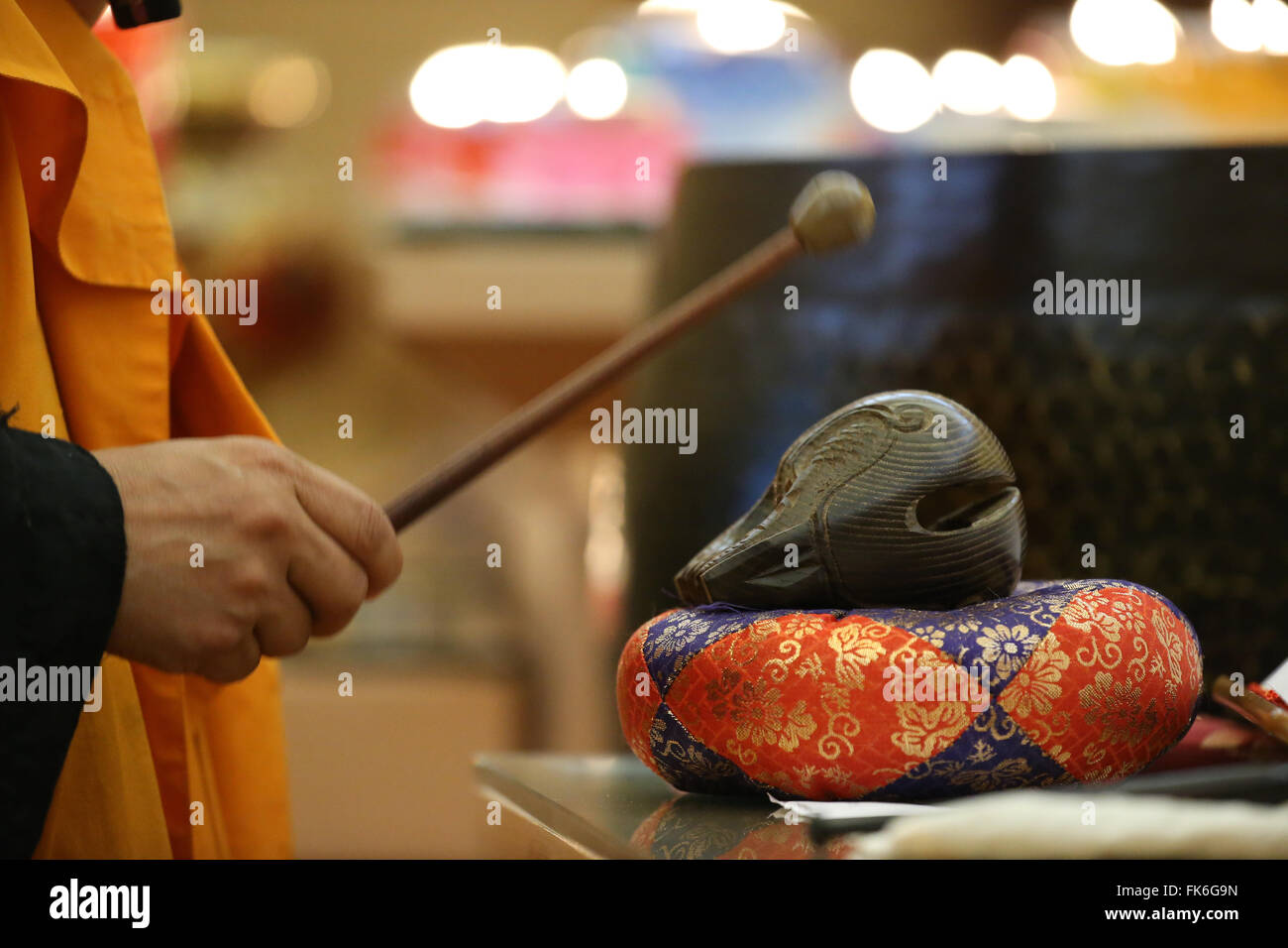 Monk playing on a wooden fish (percussion instrument), Fo Guang Shan Temple, Geneva, Switzerland, Europe Stock Photo