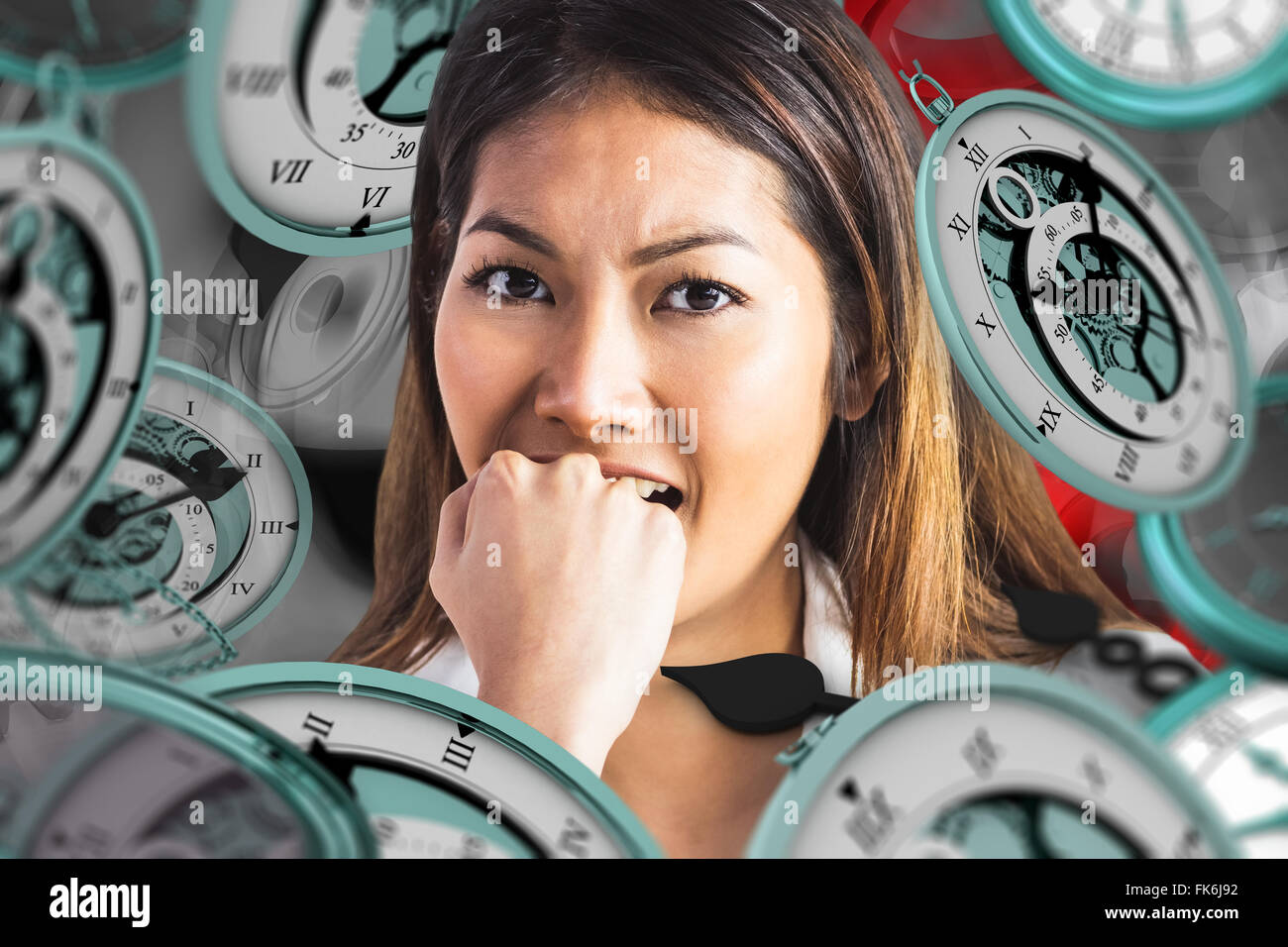 Composite image of businesswoman biting her fist Stock Photo