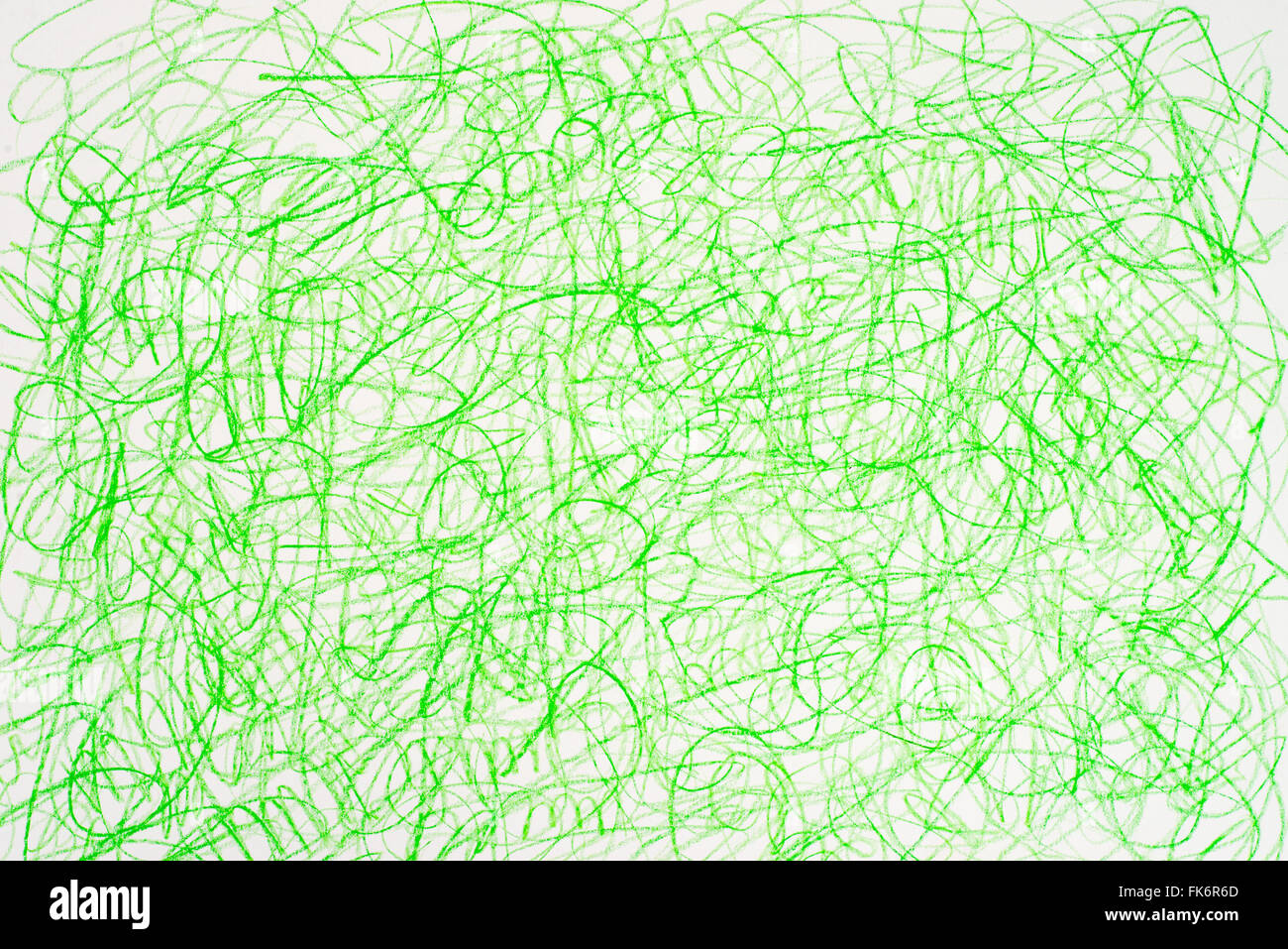 green crayon doodles on white paper background Stock Photo