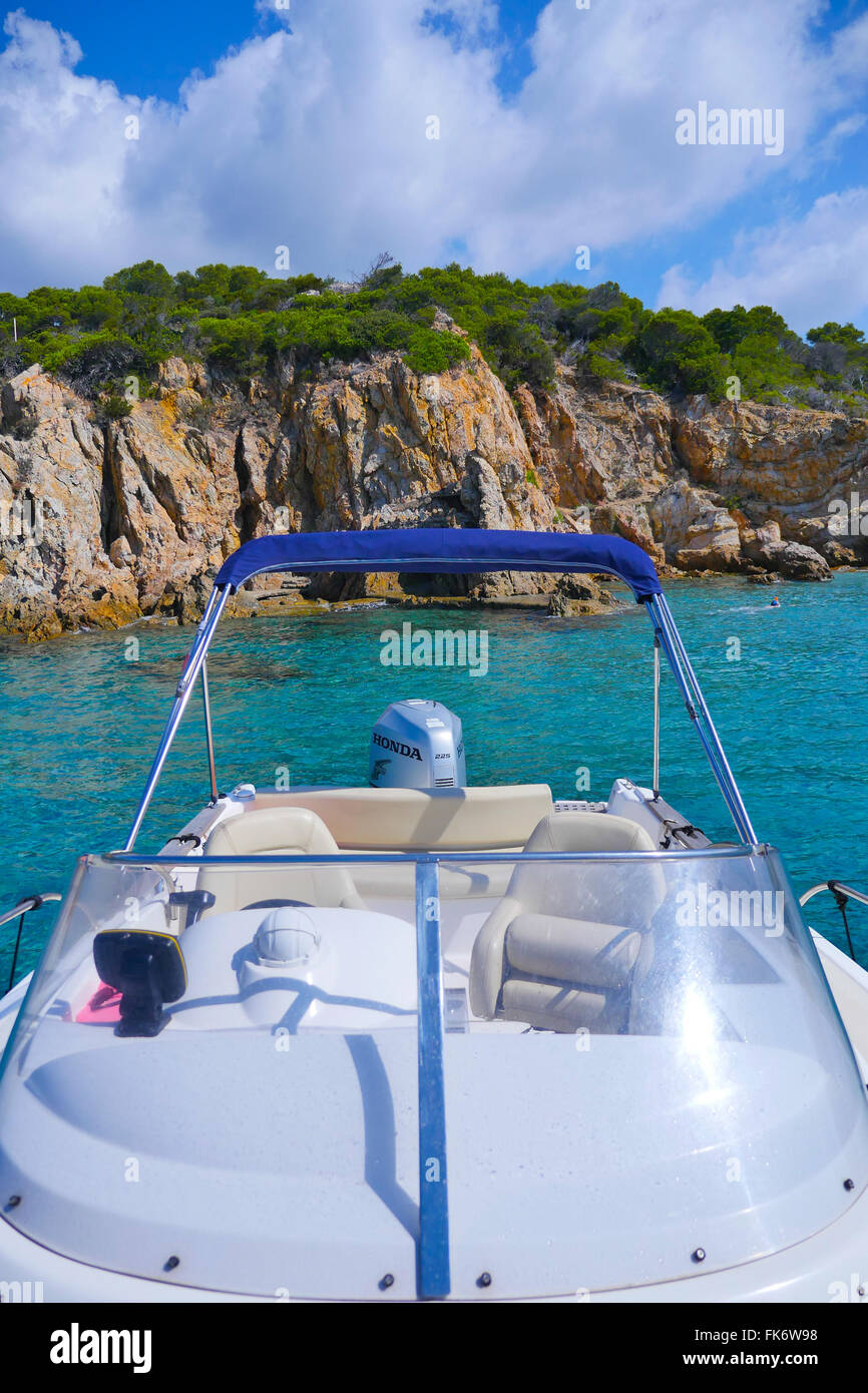 Luxury yacht anchoring at steep coast Stock Photo