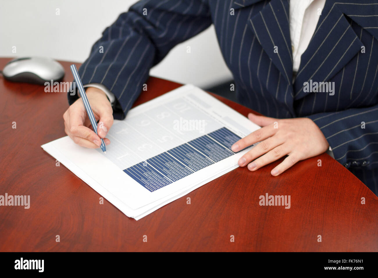 Office worker fill form in office with pen Stock Photo