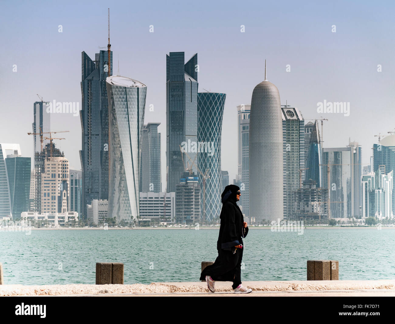 View along waterfront of Corniche towards modern office towers in Doha Qatar Stock Photo