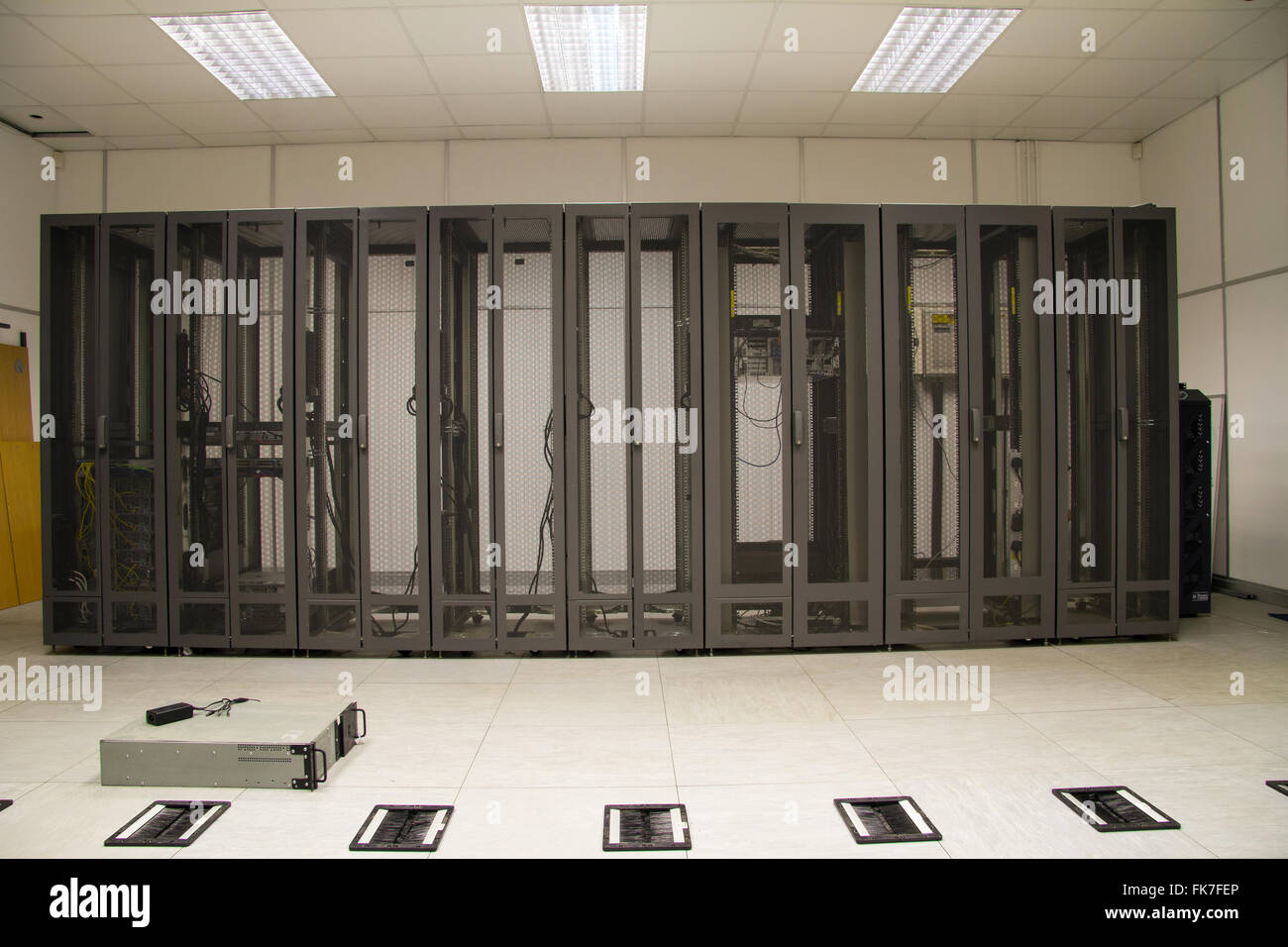 Server farm security cabinets in server room during installation. Stock Photo