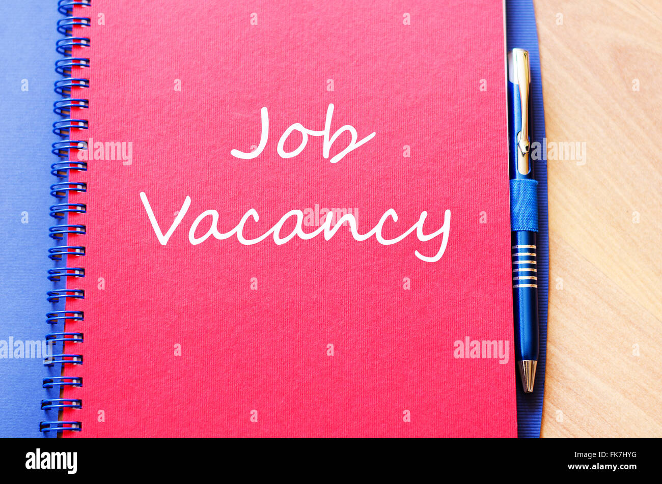 Job vacancy text concept write on notebook with pen Stock Photo - Alamy