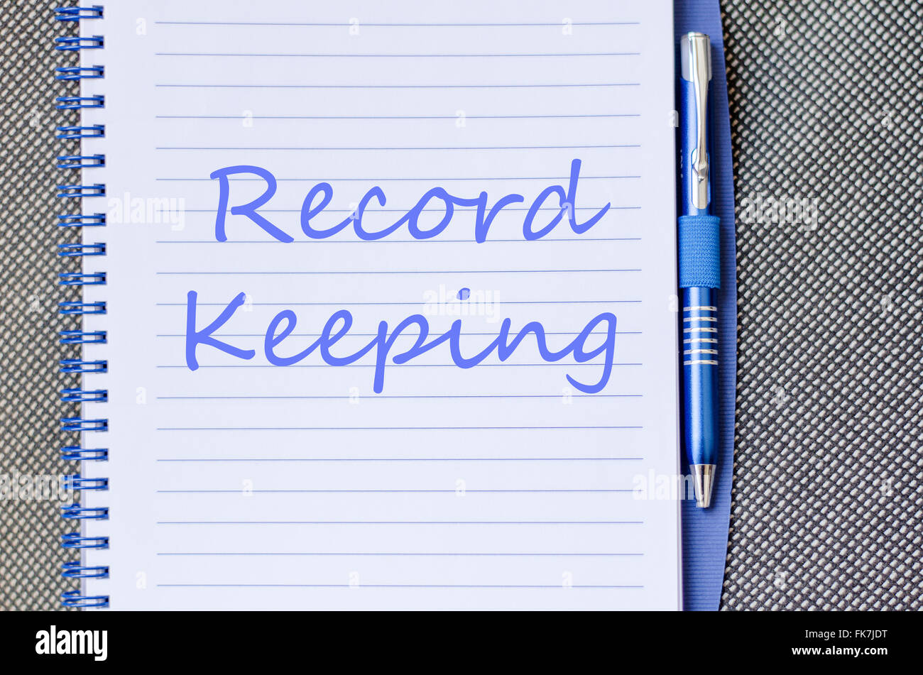 Record keeping text concept write on notebook with pen Stock Photo