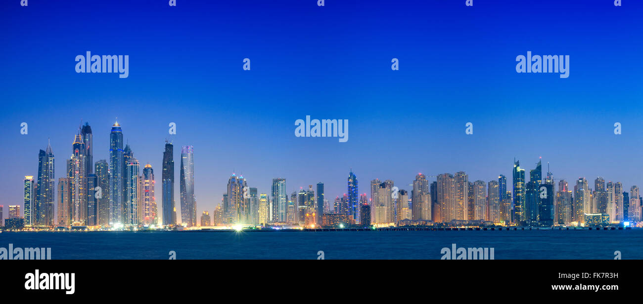 Night panorama view of many skyscrapers and apartment towers in Marina District in Dubai United Arab Emirates Stock Photo