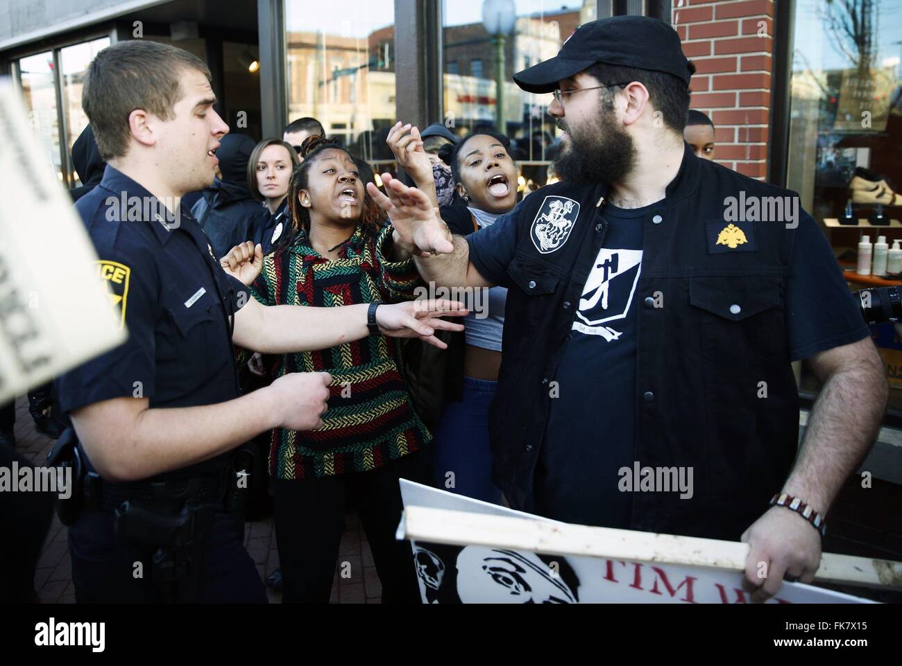 'White Pride' protester, Matthew Heimbach, right, scuffles with two counter protesters as he marches along Kirkwood with skinhead and white supremacists who arrived in Bloomington to protest independent scholar Tim Wise. Stock Photo