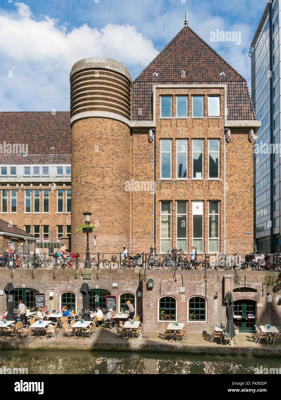 Building of former head post office and quay with wharf restaurant on Oudegracht canal in Utrecht, Netherlands Stock Photo