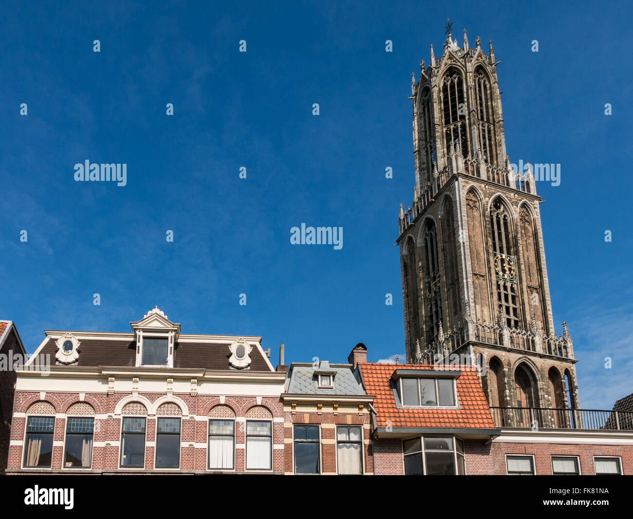 Houses on Vismarkt, Oudegracht and the tower of Dom Church in the city of Utrecht, Netherlands Stock Photo