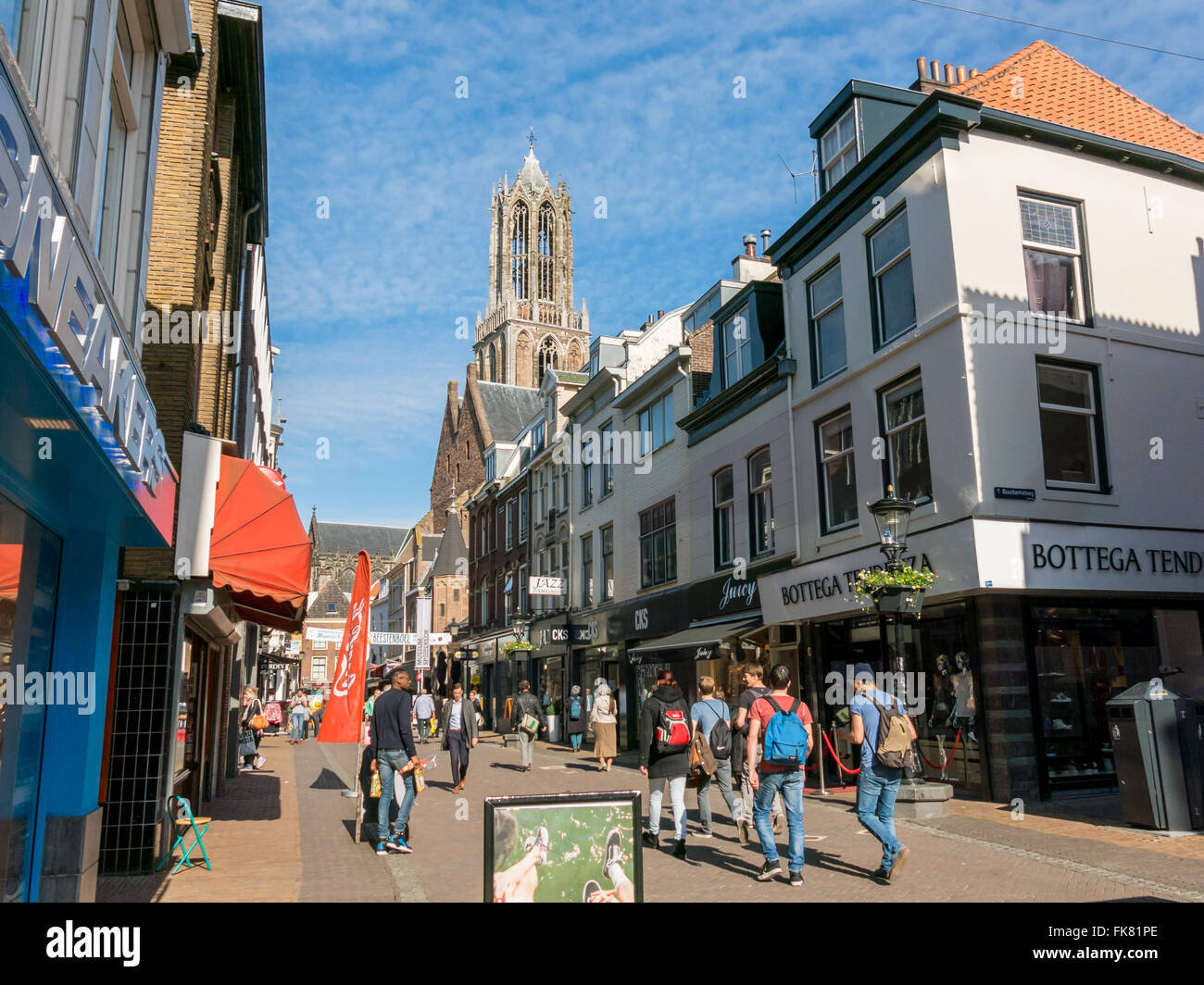 Dom church tower and people in shopping street Steenweg in the city center of Utrecht, Netherlands Stock Photo