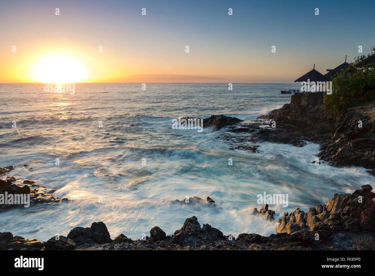 sunset-surf-on-rocky-coast-costa-adeje-tenerife-canary-islands