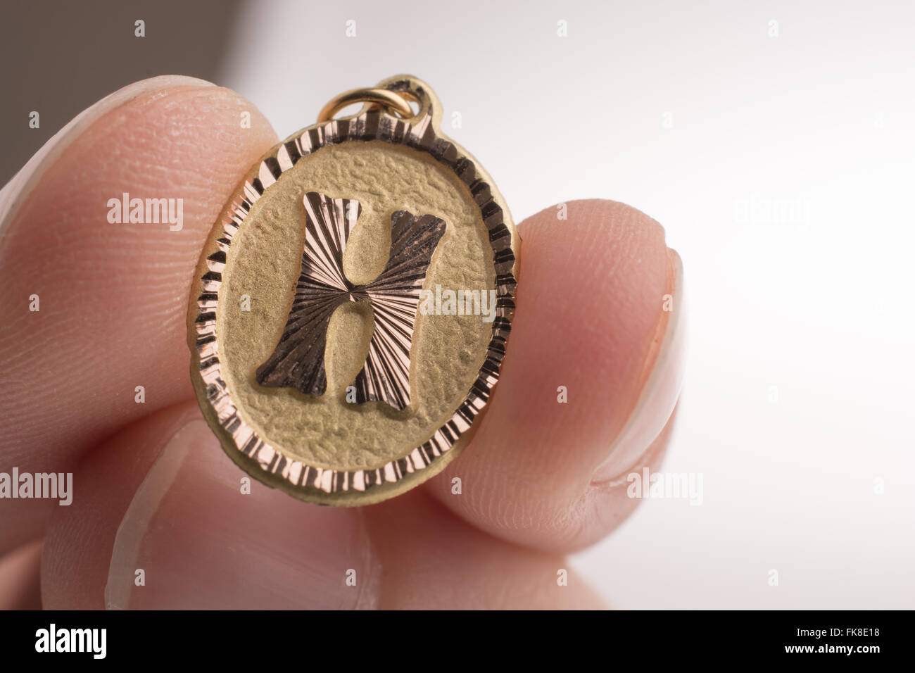 Golden Letter H on a white background Stock Photo - Alamy