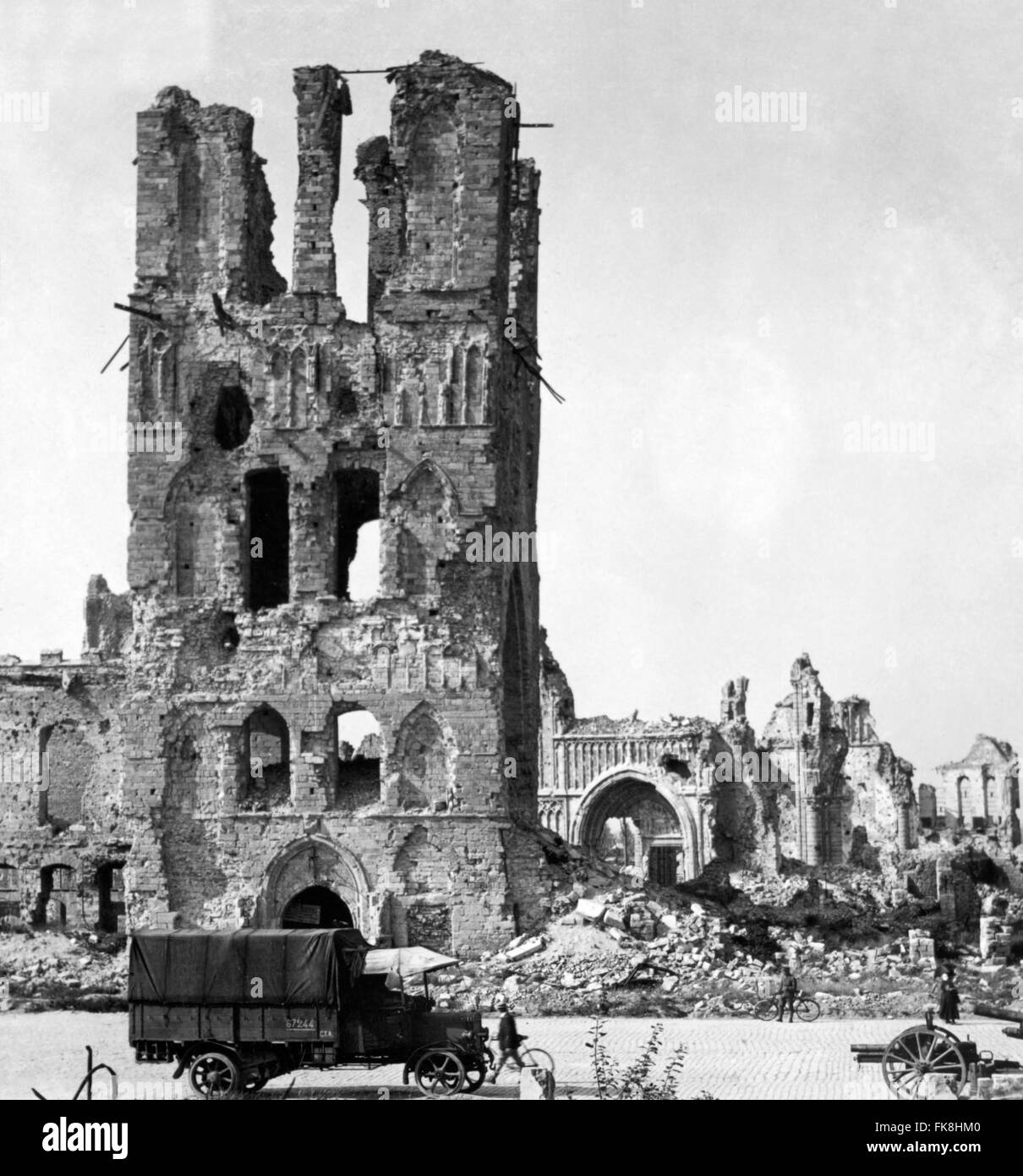 Ruins of the cathedral at Ypres with a British army truck in the foreground, Flanders, Belgium in World War I. Photo taken between 1914 and 1918 Stock Photo
