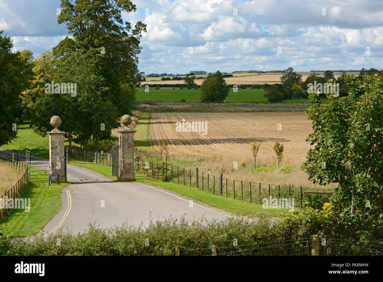 Countryside and entrance gates to Avebury Manor in Avebury, Wiltshire, England Stock Photo