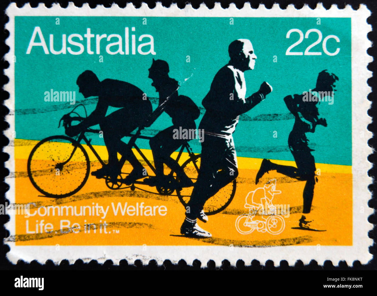 AUSTRALIA - CIRCA 1980: A stamp printed in Australia shows the Joggers and Bicyclists, with the inscription Community Welfare Stock Photo